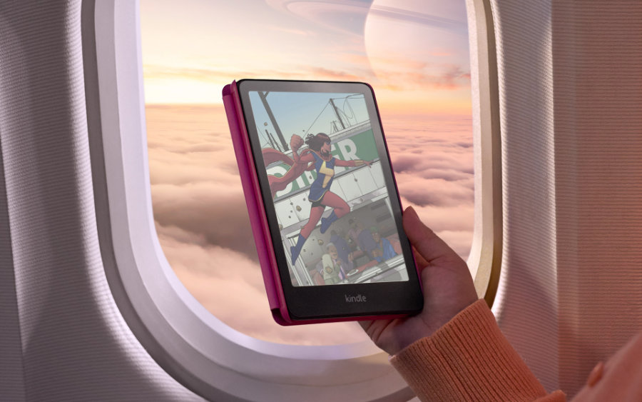 Kindle Colorsoft Signature Edition hold in front of a window in airplane